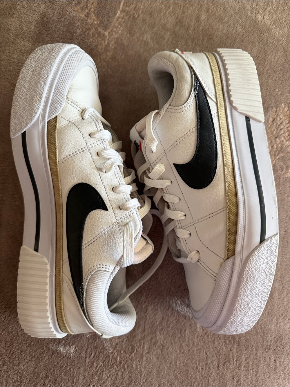 Nike White Leather Platform Sneakers with Black Swoosh and Gold Trim